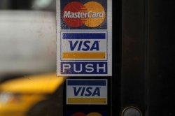 Federal judge rejects Visa, Mastercard swipe fee settlement