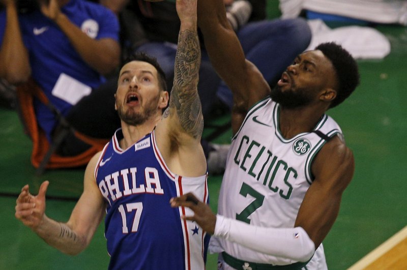 Since retiring from the NBA in 2021, JJ Redick (L, fending off Boston Celtics guard Jaylen Brown) has since established himself as a top ESPN analyst with multiple successful sports podcasts, including one that he co-hosts with LeBron James. File Photo by C.J. Gunther/EPA-EFE