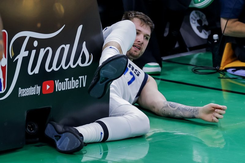 Dallas Mavericks guard Luka Doncic reacts after falling out of bounds during the second half against the Boston Celtics in Game 2 of the NBA Finals on Sunday in Boston. Photo by C.J. Gunther/EPA-EFE