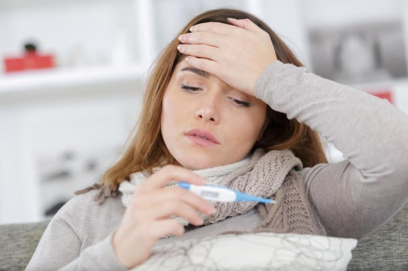 A simple and inexpensive paper strip test could help diagnose a case of the flu, and even identify the influenza strain that caused it, a new study finds. Photo by Adobe Stock/HealthDay News