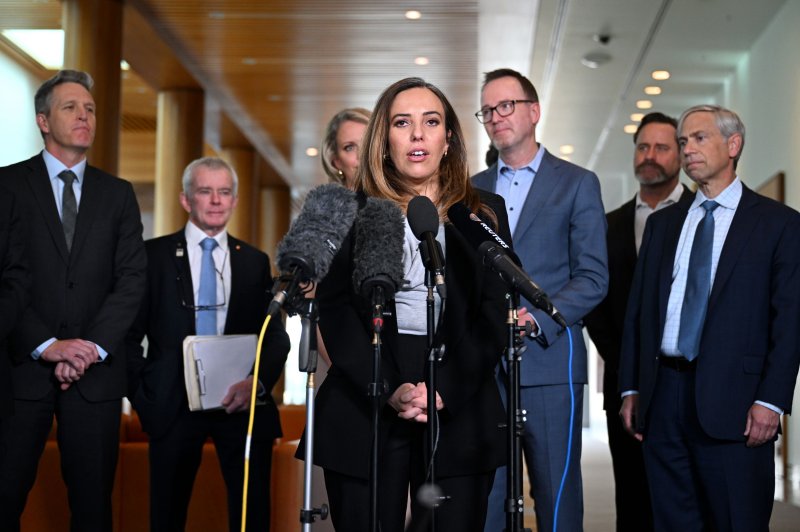 Stella Assange, wife of WikiLeaks founder Julian Assange, flanked by members of the Bring Julian Assange Home Parliamentary Group, urged journalists covering a press briefing in Canberra to lodge FOI requests with the U.S. government to get to the truth about her husband's case. Photo by Lukas Coch/EPA-EFE