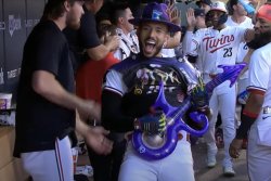 Twins' Carlos Correa celebrates homer with Prince vest, guitar tribute