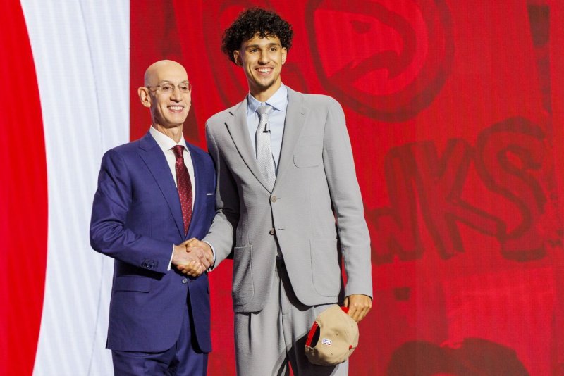 French basketball player and No. 1 draft pick Zaccharie Risacher (R) shakes hands with NBA commissioner Adam Silver after getting drafted by the Atlanta Hawks during the 2024 NBA Draft on Wednesday at Barclays Center in Brooklyn. Photo Sarah Yenesel/EPA-EFE